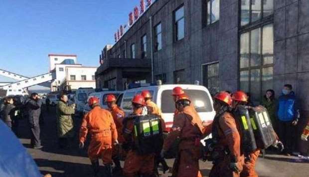 Rescue workers assemble near the mine