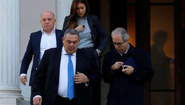 Greek Defense Minister and coalition partner Panos Kammenos exits the Maximos Mansion following a meeting with Greek Prime Minister Alexis Tsipras in Athens