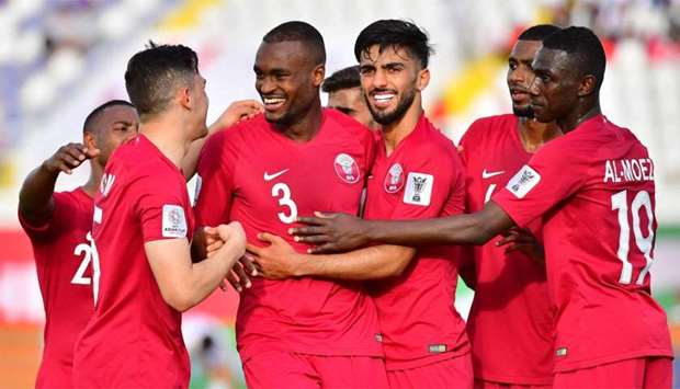 Qatar's defender AbdelKarim Hassan (3rd-L) celebrates after scoring a goal during the 2019 AFC Asian Cup group E football match between North Korea and Qatar at the Khalifa bin Zayed stadium in al-Ain