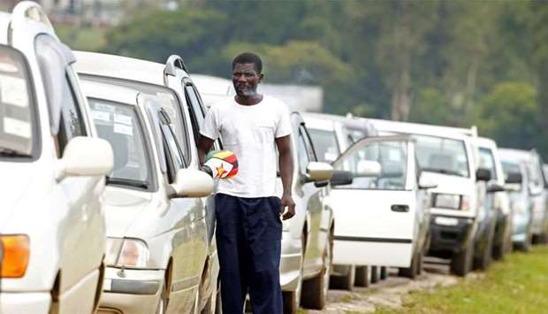 Motorists queue to buy petrol in Harare, Zimbabwe