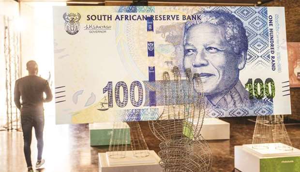 A display of a commemorative South African 100 rand banknote in Pretoria (file). Nedbank analysts have said volatility in the rand will intensify in 2019 due to slowdown in global growth.
