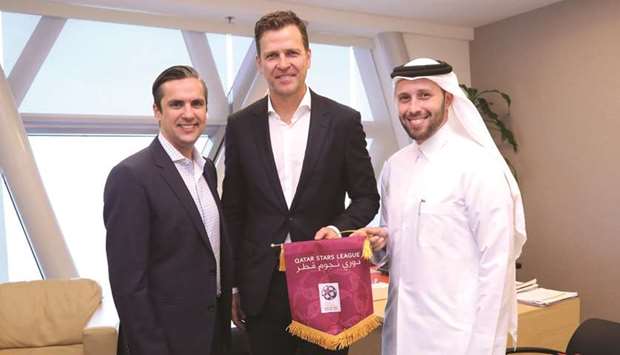 Former Germany captain and current general manager Oliver Bierhoff (centre) of DFB with QSLu2019s Acting Executive Director of Competitions & Football Development Ahmed Khellil Abbassi and Head of Football Development Miguel Heitor.