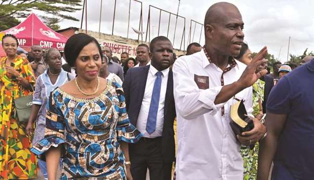 Opposition presidential candidate Martin Fayulu (right) leaves the Center Missionnaire Philadelphie (CMP) with his wife Esther after they attended a Sunday mass yesterday in the capital Kinshasa.
