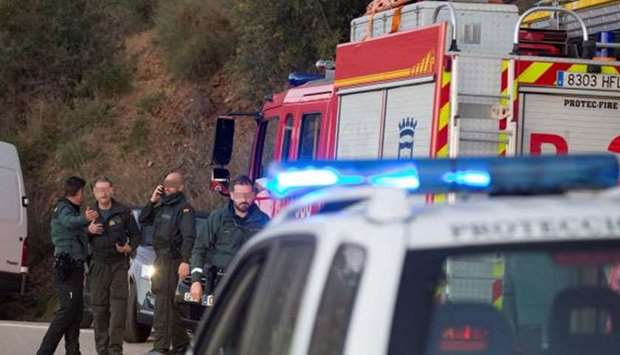 Spanish Civil Guard agents at the site where a two-year-old boy fell into a deep well shaft