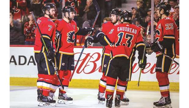 Calgary Flames defenseman Mark Giordano (second left) celebrates his goal with teammates against the Arizona Coyotes during the third period at Scotiabank Saddledome. PICTURE: USA TODAY Sports