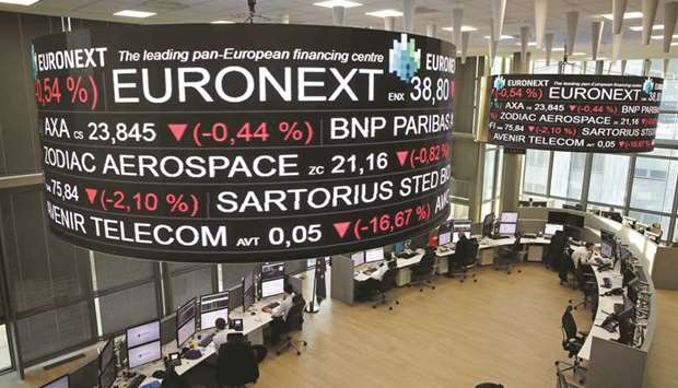 Company stock price information is displayed on screens as they hang above the Paris stock exchange, operated by Euronext, in La Defense business district in Paris. Euronext, which already runs exchanges in Paris, Brussels, Amsterdam, Lisbon and Dublin, is offering 145 Norwegian crowns per share, valuing Oslo Bors at $729mn.