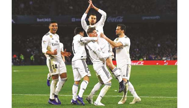 Real Madridu2019s Dani Ceballos celebrates with teammates after scoring their second goal against Real Betis on Sunday.