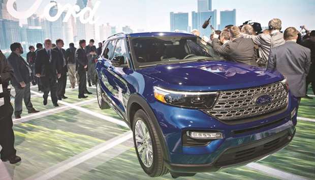 A Ford Explorer Hybrid SUV is displayed during the 2019 North American International Auto Show in Detroit yesterday. Fordu2019s redesigned Explorer is on public display for the first time, with a high-powered version of the Mustang sports car called the Shelby GT500 also to be unveiled at the show.