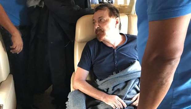 Former far-left Italian militant Cesare Battisti sitting aboard a plane chartered by the Italian government, prior to taking off from Santa Cruz de la Sierra, Bolivia, yesterday. AFP/POLIZIA DI STATO