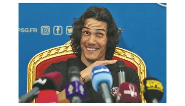 PSGu2019s Uruguayan star Edinson Cavani smiles as he speaks to the media in Doha yesterday. The top French football side are holding a winter camp in Qatar.
