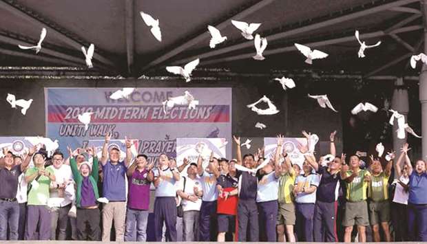 Participants in the Unity Walk, Inter-Faith Prayer Rally and Peace Covenant signing for the 2019 Midterm Elections at the Quezon City Memorial Circle, release doves as a sign of their commitment to peaceful, honest, orderly and credible elections.