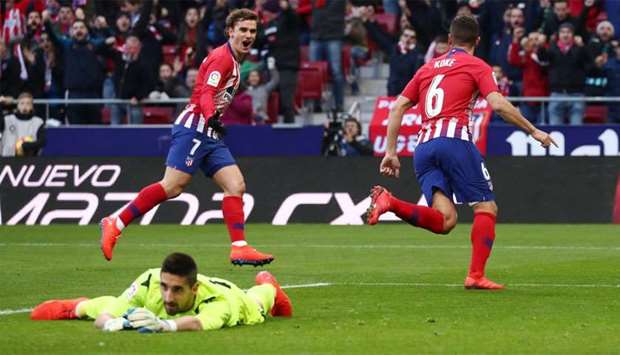 Atletico Madrid's Koke celebrates a goal with Antoine Griezmann that is later disallowed following a VAR review