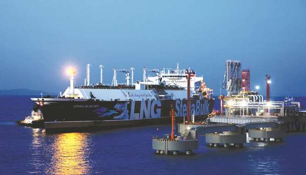 An LNG tanker is seen at the liquefied natural gas terminal owned by Chinese energy company ENN Group, in Zhoushan, Zhejiang province (file). China accounted for 65% of global LNG demand growth last year, according to Sanford C Bernstein & Co.