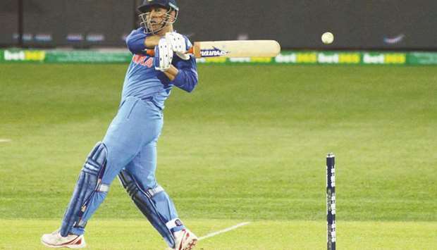 Indiau2019s Mahendra Singh Dhoni in action during the second ODI against Australia in Adelaide yesterday. AFP)