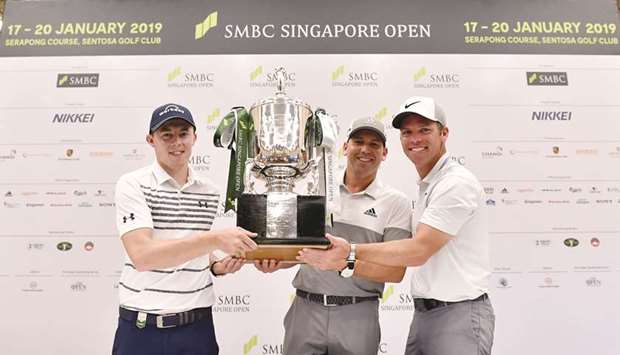 (From left) Golfers Matthew Fitzpatrick of England, Sergio Garcia of Spain and Paul Casey of England pose with the Singapore Open trophy at a press conference yesterday. (AFP)