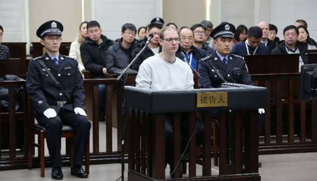 Canadian Robert Lloyd Schellenberg appears in court for a retrial of his drug smuggling case in Dalian, Liaoning province, China, yesterday.