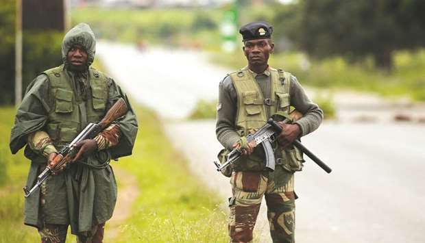 Soldiers patrol during protests on a road leading to Harare yesterday.