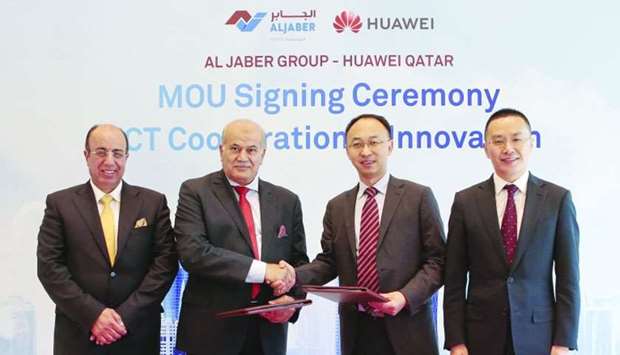 Huawei and Al Jaber Group officialsrn
