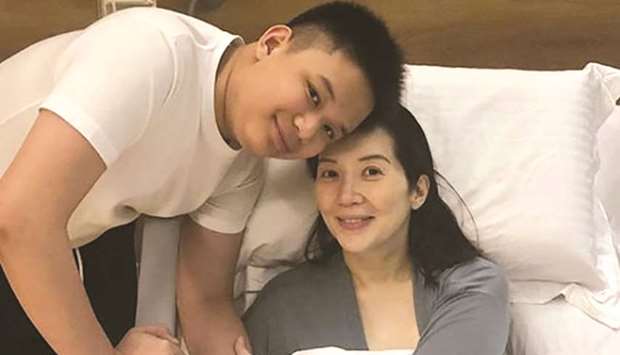 Kris Aquino poses for a photo with her son Bimby shortly after being discharged from a Singapore hospital.