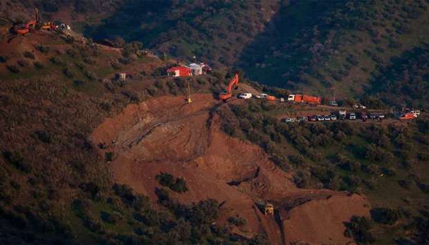 Rescue workers continue efforts to find a boy who fell down a well in Totalan in southern Spain