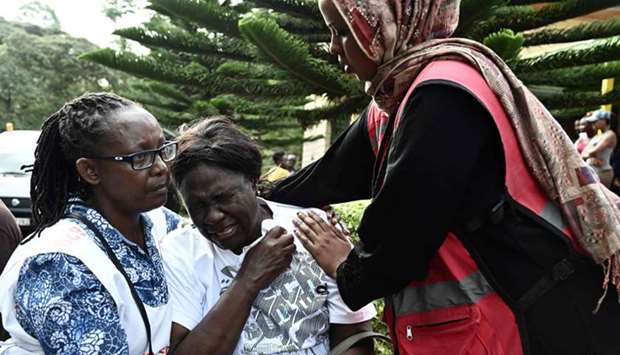 A woman cries after identifying the body of a relative at the Chiromo mortuary in Nairobi, Kenya yesterday.