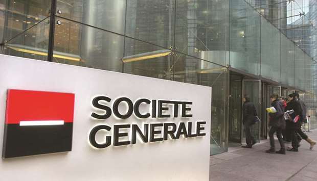 Visitors enter the headquarters of Societe General, at La Defense, outside Paris. The Paris-based lender shuttered the unitu2019s Hong Kong desk towards the end of 2018 and has pulled back from some trading strategies, sources said.