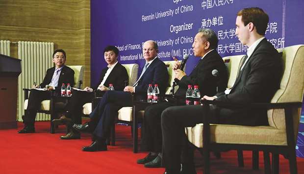 Germanyu2019s Finance Minister Olaf Scholz (centre) listens to fellow participants during a roundtable seminar on the digital economy and social development, at Renmin University in Beijing. Scholz is campaigning for Germany to become a hub for Chinese and renminbi-denominated financial products in Europe, after Britainu2019s exit from the European Union.