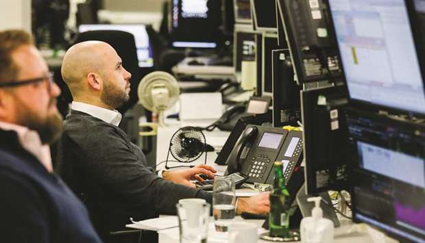 Traders monitor financial data on computer screens on the trading floor at ETX Capital, a broker of contracts-for-difference, following the results of the UK Parliament Brexit deal in London on Tuesday. On the Cityu2019s trading floors, a more benign view of the situation is taking shape. Luke Pledger, the senior managing director who oversees sterling at BGC Partners, an inter-dealer broker based in Londonu2019s Canary Wharf, said the markets are signalling a softer Brexit is most likely.