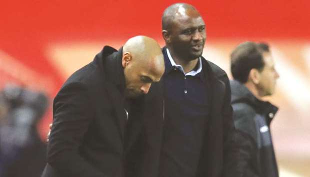 Monacou2019s coach Thierry Henry (left) embraces his Nice counterpart Patrick Vieira after the Ligue 1 match in Monaco. (AFP)