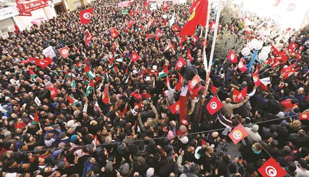 People shout slogans in Tunis yesterday during a nationwide strike against the governmentu2019s refusal to raise wages.
