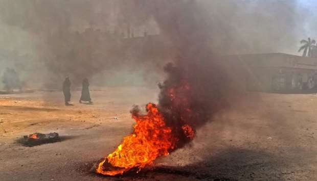 Sudanese protestors burn tires during an anti-government demonstration in the capital Khartoum