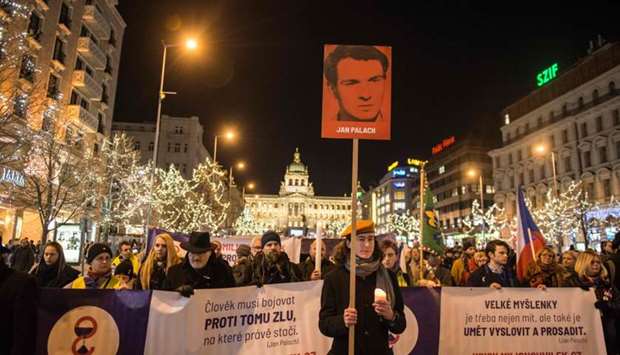 People march to commemorate the 50th anniversary of Jan Palach's death on January 16, 2019 at Wenceslas Square in Prague