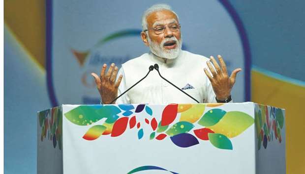Indiau2019s Prime Minister Narendra Modi speaks during the Vibrant Gujarat Global Summit in Gandhinagar. A series of vote-catching measures planned by Modi as he braces for a difficult general election may cost more than Rs1tn ($14bn), two sources with direct knowledge of the matter said yesterday.