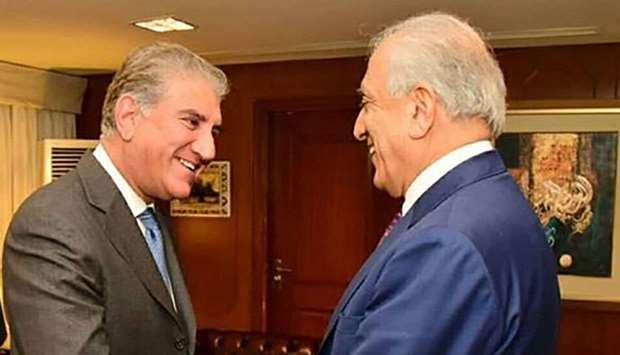 Pakistan's Foreign Minister Shah Mahmood Qureshi (L) meets with US envoy Zalmay Khalilzad -- the US Special Representative for Afghanistan Reconciliation