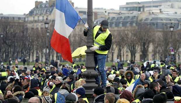 Protesters wearing yellow vests take part in a demonstration by the u2018yellow vestsu2019 movement, in Paris