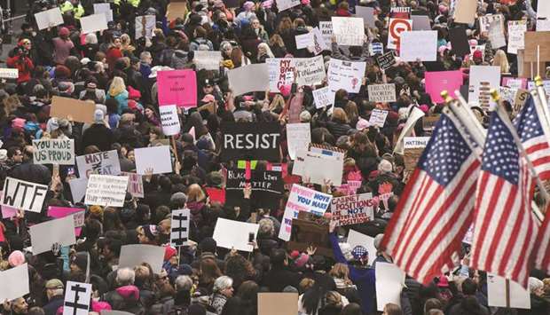 This picture taken on January 21, 2017 shows people participating in a Womenu2019s March to protest against Trump in New York City.