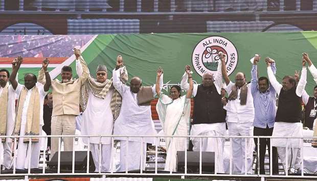Trinamool Congress Mamata Banerjee and other leaders join hands at a mass meeting in Kolkata yesterday.