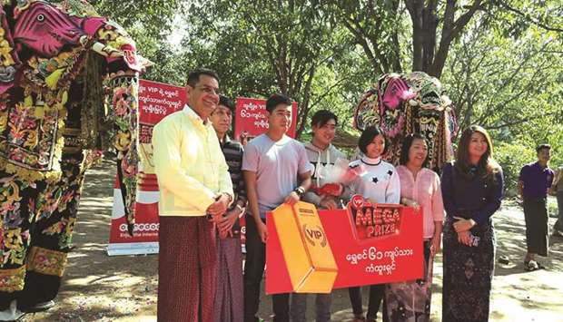 The Ooredoo VIP programme winner and family with Ooredoo officials.