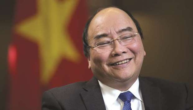 Nguyen Xuan Phuc, Vietnamu2019s prime minister, reacts during a Bloomberg Television interview in Hanoi. u201cWe are trying to increase exports in both quantity and quality of our products, especially in which we have advantages, such as seafood, commodities, footwear and electronics,u201d Phuc said.