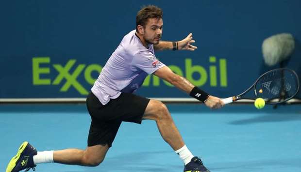 Switzerland's Stan Wawrinka in action against Russia's Karen Kachanov during the first round of the Qatar Exxon Mobil Open at the Khalifa International Tennis and Squash Complex Tuesday. Wawrinka won in straight sets.