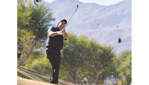 Phil Mickelson of the United States hits out of the rough during the third round of the Desert Classic at the Stadium Course in La Quinta, California.