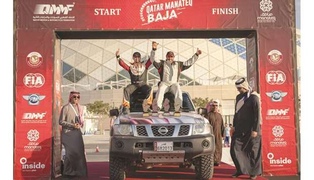Mohamed al-Meer (top right) and his Russian co-driver Alex Kuzmich celebrate after winning the overall title of the Manateq Qatar National Baja championship at the Qatar Motor and Motorcycle Federationu2019s headquarters at Lusail Sports Hall. At bottom, participants pose with Qatar Motor and Motorcycle Federation officials after the sixth and final round of the Manateq Qatar National Baja championship at Lusail Sports Hall.