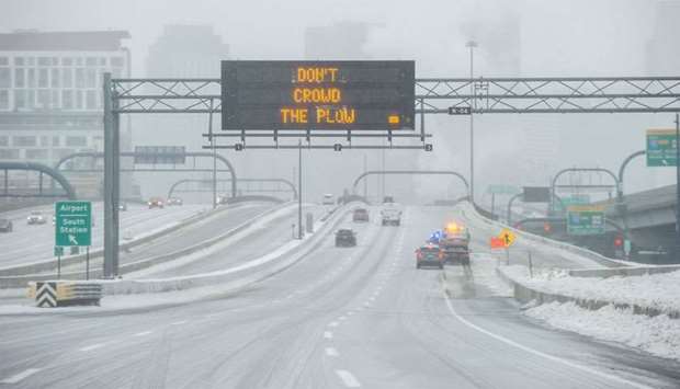 Ice and snow cover Interstate 93 through the city during Winter Storm Harper in Boston