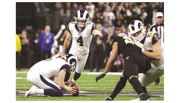 LA Rams kicker Greg Zuerlein (second from left) kicks the winning field goal against the New Orleans Saints during overtime in the NFC Championship game in New Orleans on Sunday. (USA TODAY Sports)