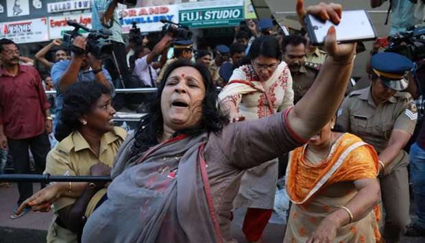India police intervene as members of Sabarimala Karma Samithi try to disrupt a celebratory meeting after two women entered Sabarimala Ayyapa temple, at the High Court Junction in Kochi in the Indian state of Kerala