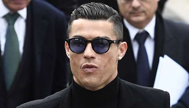 Cristiano Ronaldo arrives to attend a court hearing for tax evasion in Madrid