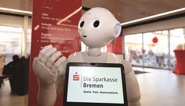 WELCOME: The robot Luna Pepper welcomes customers in a bank branch in Germany, chats with them about the weather, and even tells jokes.