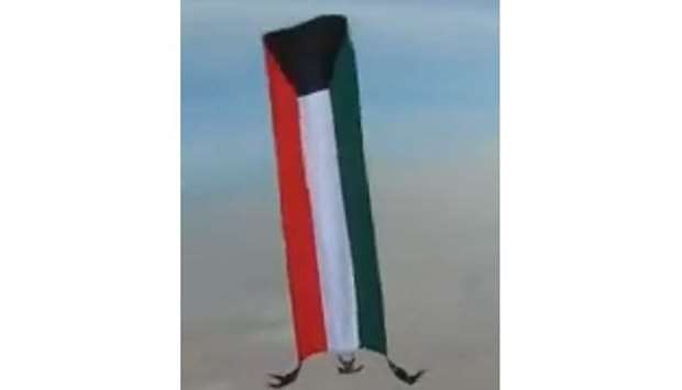 A team of three Kuwaiti parachuters selected Skydive Qatar to break a Guinness record,  leaping 13,000ft while carrying the largest Kuwaiti flag of 63sqm. PICTURE: Courtesy of Skydive Qatar Twitter page