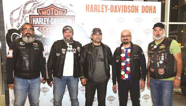Khaled al-Jaber (2nd right) with Harley Owners Group u2013 Qatar officials.