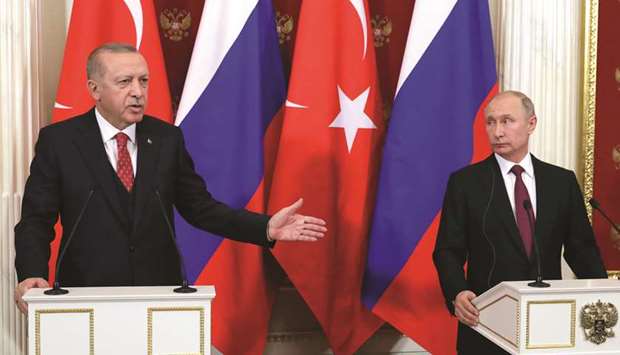 Russian President Vladimir Putin and his Turkish counterpart Tayyip Erdogan attend a news conference after their meeting at the Kremlin in Moscow, yesterday.